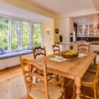 A beautifully renovated living room featuring hardwood floors and custom built-ins.