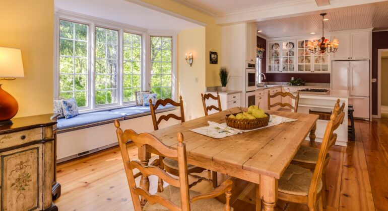 A beautifully renovated living room featuring hardwood floors and custom built-ins.